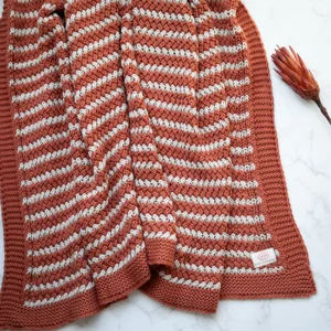 Tara organic cotton knit throw | Rust